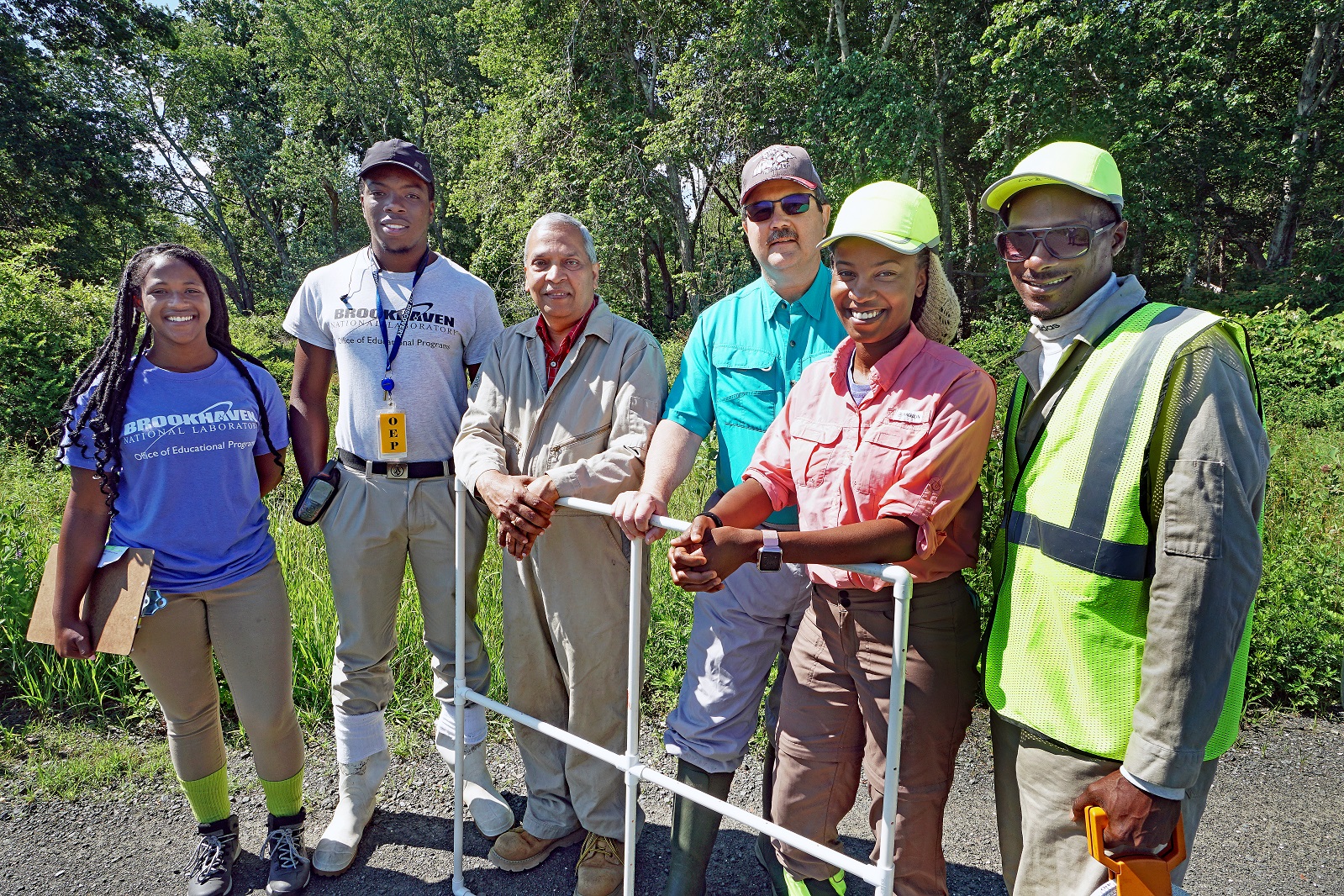 Southern University at New Orleans (SUNO) students (left to right) Chelsea Brown, Trevor McIntosh, Raven Williams, and Dulaine Vining with their biology professor, Murty Kambhampati (third from left), and Brookhaven Lab mentor, Timothy Green (third from right) of the Environmental Protection Division. Kambhampati has been bringing his undergraduate students to Brookhaven Lab to conduct field research in natural resource management. The Brookhaven Lab–SUNO collaboration began after Hurricane Katrina devastated New Orleans in 2005